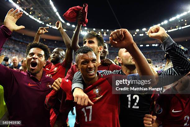 Nani and Portugal players celebrate after their team's 1-0 win against France in the UEFA EURO 2016 Final match between Portugal and France at Stade...