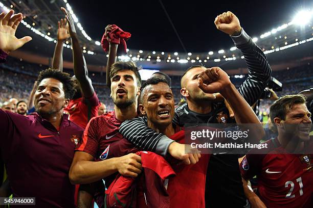 Nani and Portugal players celebrate after their team's 1-0 win against France in the UEFA EURO 2016 Final match between Portugal and France at Stade...