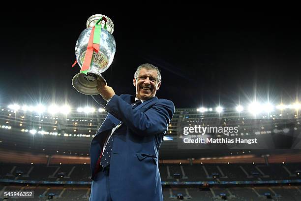 Fernando Santos manager of Portugal lifts the Henri Delaunay trophy to celebrate after his team's 1-0 win against France in the UEFA EURO 2016 Final...