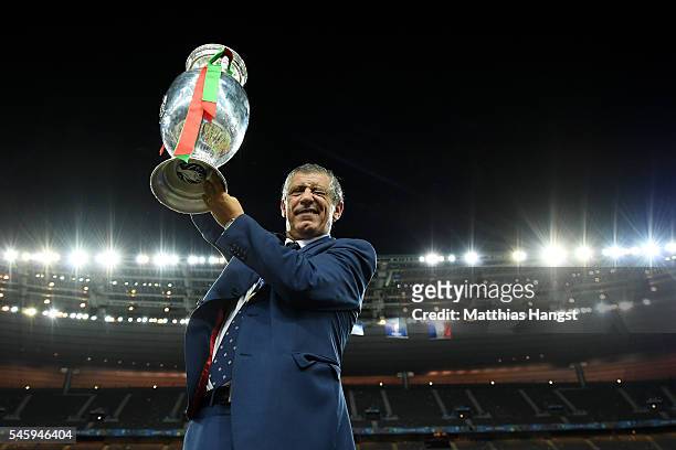 Fernando Santos manager of Portugal lifts the Henri Delaunay trophy to celebrate after his team's 1-0 win against France in the UEFA EURO 2016 Final...