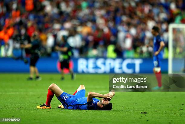 Andre-Pierre Gignac of France shows his dejection after his team's 0-1 defeat in the UEFA EURO 2016 Final match between Portugal and France at Stade...