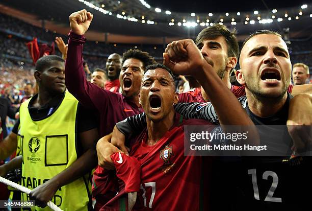 Nani and Portugal players celebrate after their team's 1-0 win against France in the UEFA EURO 2016 Final match between Portugal and France at Stade...