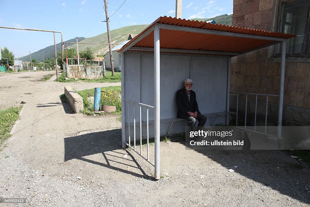 Armenia - man in a bus shelter