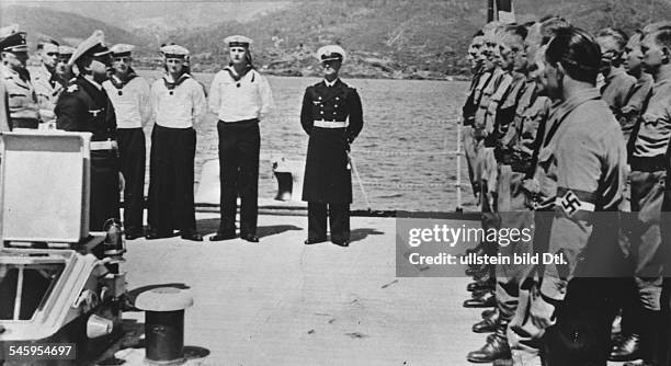 Germany, Third Reich - Foreign Organisation of the Nazi Party The commandant of the training ship 'Schlesien' talking to the political leaders of the...