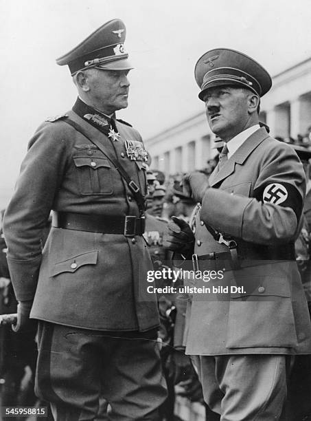 Germany, Third Reich - NSDAP Nuremberg Rally 1936 Adolf Hitler talking to Reich Minister of Defense Werner von Blomberg