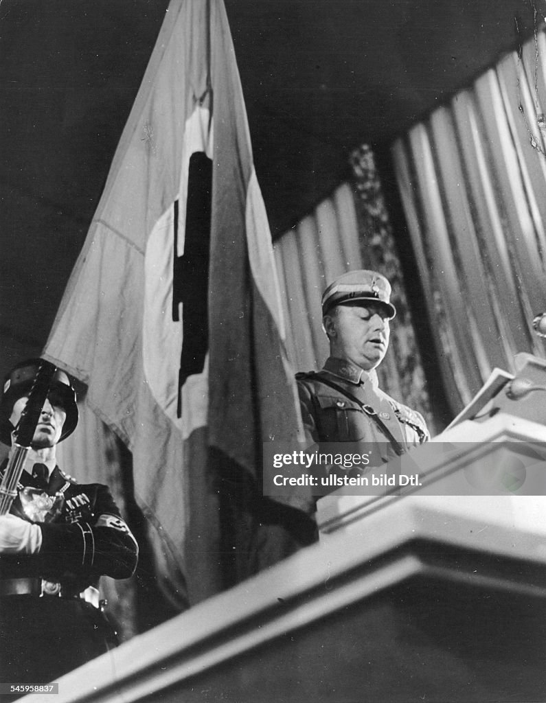 Germany, Third Reich - Nuremberg Rally 1935 SA chief of staff Viktor Lutze is reading out the names of those who fell for the (Nazi) movement at the solemn opening of the party convention| at the back: Jakob Grimminger with the so-called 'blood flag'