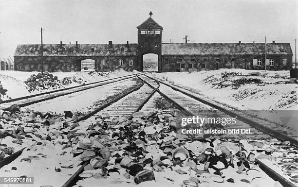Germany, Third Reich - concentration camps 1939-45 Auschwitz Concentration Camp: The entrance after the liberation. In front: material left behind by...