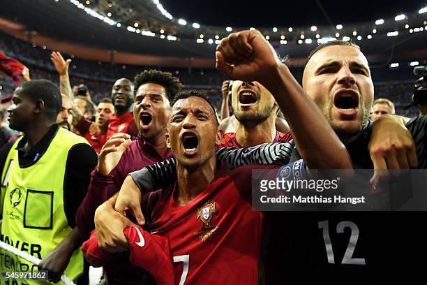 Nani and Portugal players celebrate after their team's 1-0 win against France in the UEFA EURO 2016 Final match between Portugal and France at Stade...