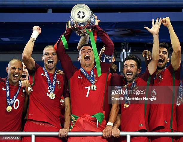 Cristiano Ronaldo of Portugal lifts the Henri Delaunay trophy after his side win 1-0 against France during the UEFA EURO 2016 Final match between...