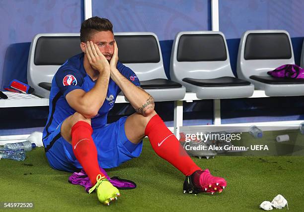 Olivier Giroud of France shows his dejection after his team's 0-1 defeat in the UEFA EURO 2016 Final match between Portugal and France at Stade de...