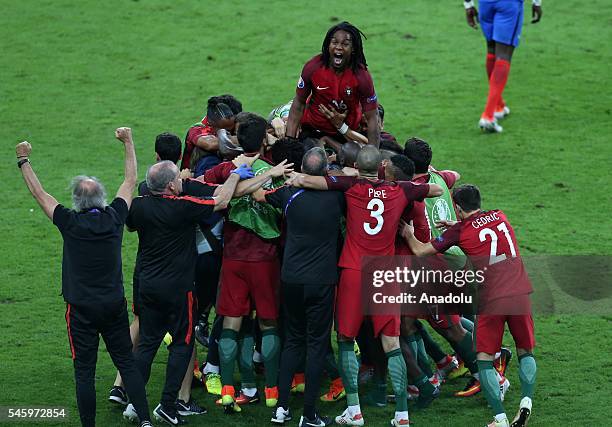 Portugal's players celebrate after beating France during the Euro 2016 final football match at the Stade de France in Saint-Denis, north of Paris,...