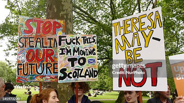 Pro-European Union supporters and pro-Brexit supporters hold up placards during a demonstration against Brexit in Green Park in London on July 9,...