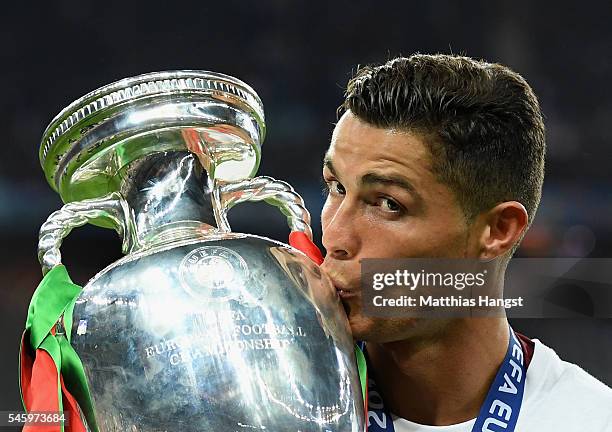 Cristiano Ronaldo of Portugal kisses the Henri Delaunay trophy to celebrate after their 1-0 win against France in the UEFA EURO 2016 Final match...