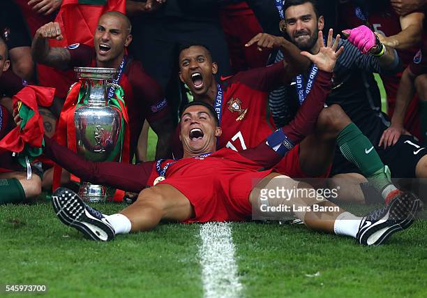 Cristiano Ronaldo and Portugal players celebrate after their 1-0 win against France in the UEFA EURO 2016 Final match between Portugal and France at...