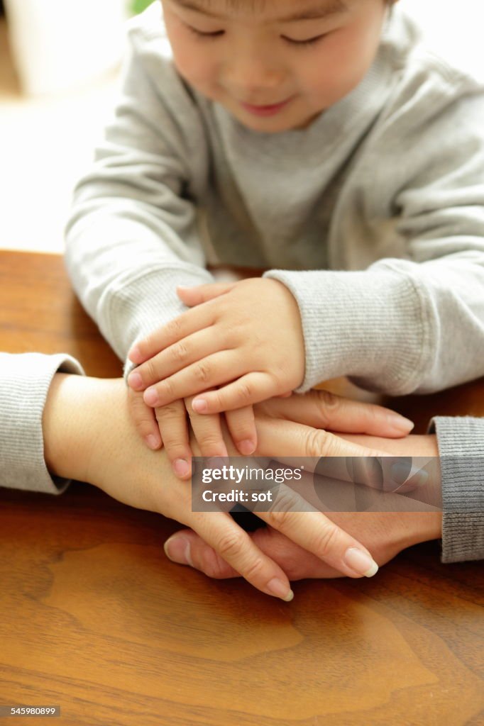 Hand of the family with baby boy