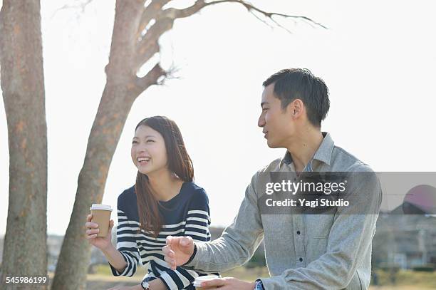 asian couple enjoy talk - コーヒー　日本人 ストックフォトと画像