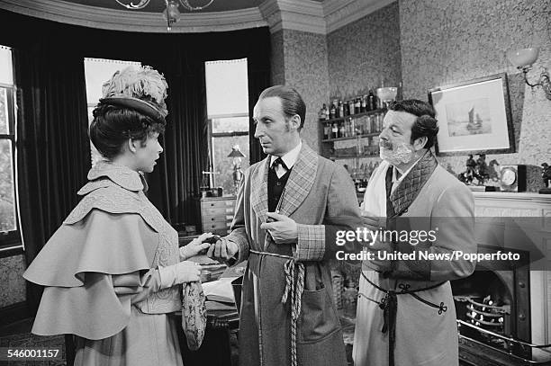 Actors Cherie Lunghi, Ian Richardson and David Healy pictured together dressed in character as Mary Morstan, Sherlock Holmes and Doctor Watson during...