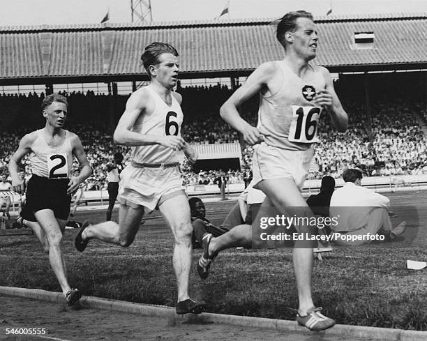 British middle distance runner Derek Ibbotson leads Christopher Chataway and Tony Barrett in the Three-Mile event at the AAA Championships at White...