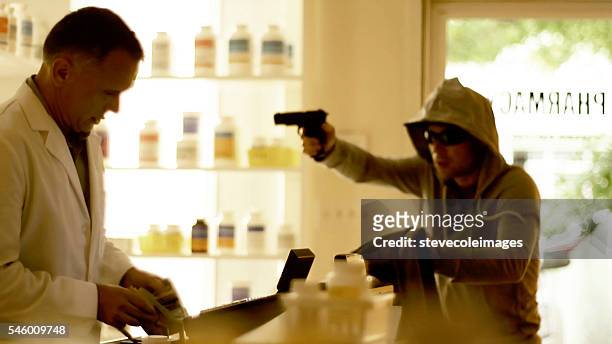 armed robbery - armed robbery stock pictures, royalty-free photos & images