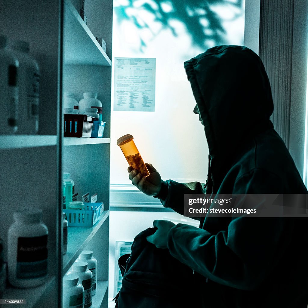 A young male drug addict stealing prescriptions.