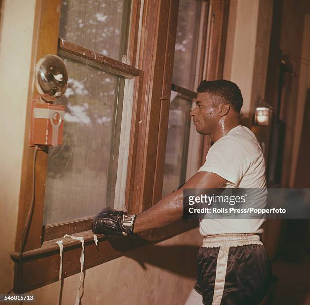 American boxer Floyd Patterson works out, in preparation for an upcoming fight with Eddie Machen, at a training camp in Marlboro, New York on 17th...