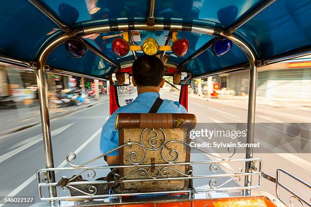 tuk tuk driver speeding in bangkok - auto rickshaw stock pictures, royalty-free photos & images