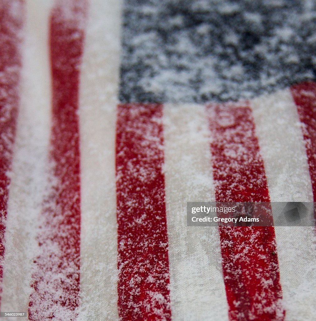 American flag covered in snow