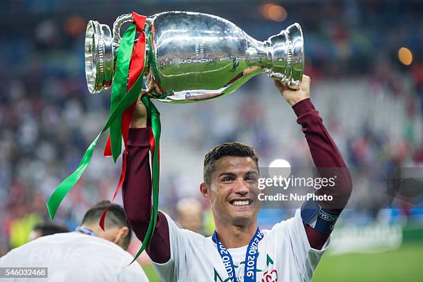 Cristiano Ronaldo celebrates with teammtes after Portugal won the Euro 2016 final football match between Portugal and France at the Stade de France...