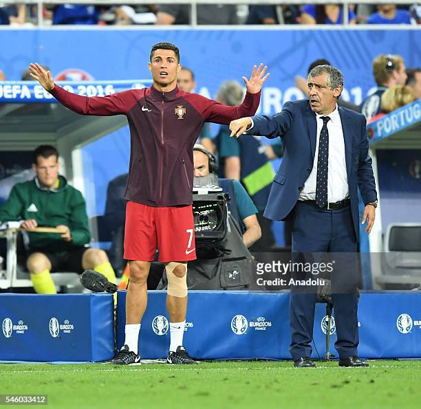 Portugal's Cristiano Ronaldo and head coach of Portugal Fernando Santos are seen during the Euro 2016 final football match between Portugal and...