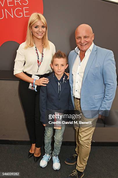Holly Willoughby poses with Aldo Zilli and son Rocco at the British Grand Prix in the Drivers Lounge at Silverstone on July 10, 2016 in Northampton,...