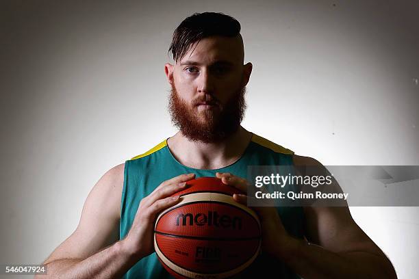 Aron Baynes poses Mission during the Australian Olympic Games Men's Basketball team announcement at Melbourne Sports and Aquatic Centre on July 11,...