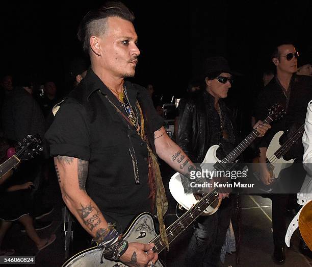 Johnny Depp and Joe Perry of Hollywood Vampires backstage before performing at Ford Ampitheater at Coney Island Boardwalk on July 10, 2016 in...