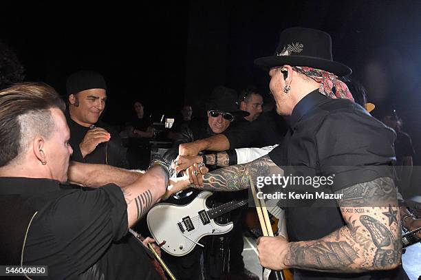 Johnny Depp, Joe Perry and Matt Sorum of Hollywood Vampires backstage before performing at Ford Ampitheater at Coney Island Boardwalk on July 10,...