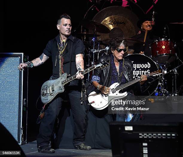 Johnny Depp and Joe Perry of Hollywood Vampires perform at Ford Ampitheater at Coney Island Boardwalk on July 10, 2016 in Brooklyn, New York.