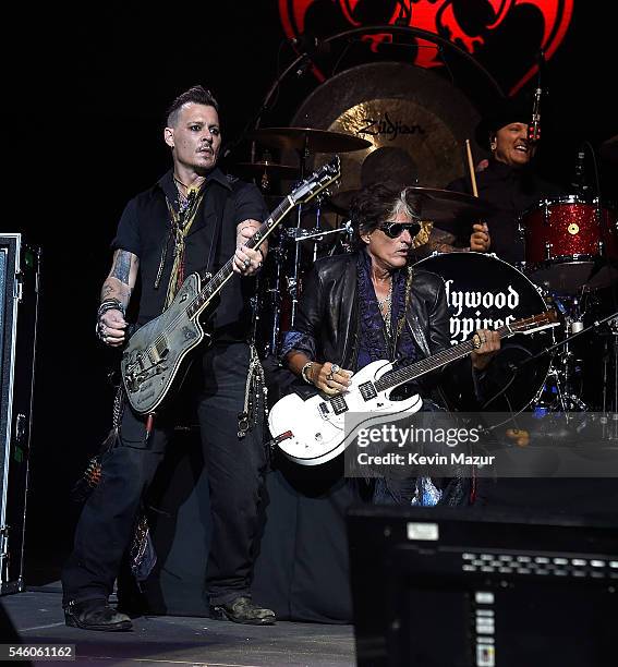 Johnny Depp and Joe Perry of Hollywood Vampires perform at Ford Ampitheater at Coney Island Boardwalk on July 10, 2016 in Brooklyn, New York.