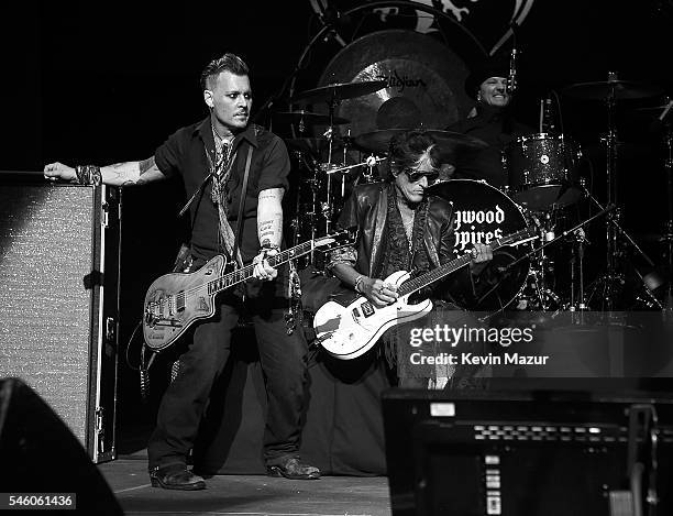 Johnny Depp and Joe Perry of Hollywood Vampires perform at Ford Ampitheater at Coney Island Boardwalk on July 10, 2016 in Brooklyn, New York.