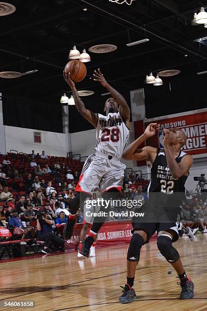 Russ Smith of the Portland Trail Blazers goes to the basket against CJ Williams of the San Antonio Spurs during the 2016 NBA Las Vegas Summer League...