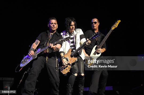 Johnny Depp, Tommy Henriksen and Robert DeLeo of Hollywood Vampires performs at Ford Ampitheater at Coney Island Boardwalk on July 10, 2016 in...