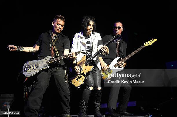 Johnny Depp, Tommy Henriksen and Robert DeLeo of Hollywood Vampires performs at Ford Ampitheater at Coney Island Boardwalk on July 10, 2016 in...