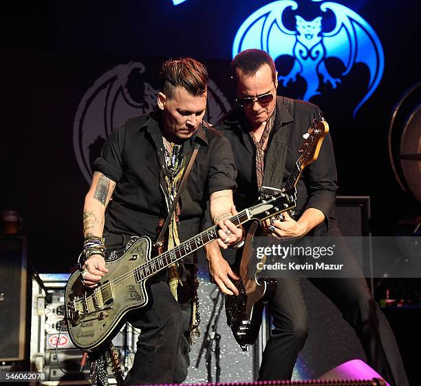 Johnny Depp and Robert DeLeo of Hollywood Vampires performs at Ford Ampitheater at Coney Island Boardwalk on July 10, 2016 in Brooklyn, New York.