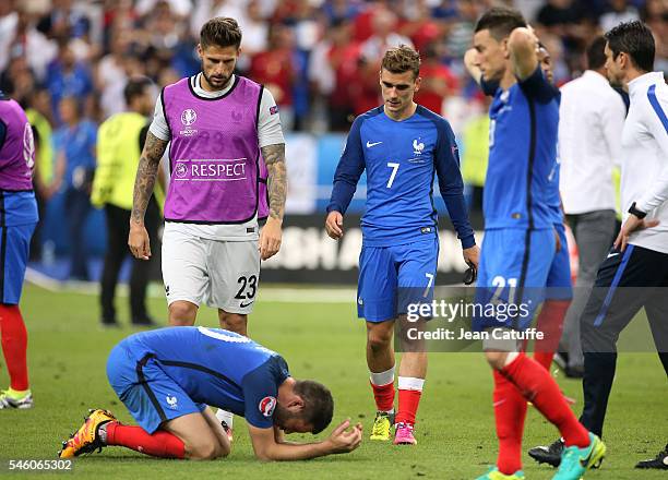 Andre-Pierre Gignac, goalkeeper of France Benoit Costil, Antoine Griezmann, Laurent Koscielny of France react following the UEFA Euro 2016 final...