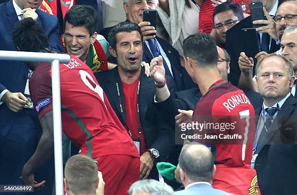 Luis Figo greets Cristiano Ronaldo of Portugal during the trophy ceremony of the UEFA Euro 2016 final between Portugal and France at Stade de France...