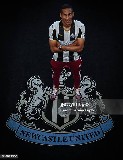 Newcastle's fifth summer signing Isaac Hayden poses for photographs with the club crest holding a football at St.James Park on July 9 in Newcastle...