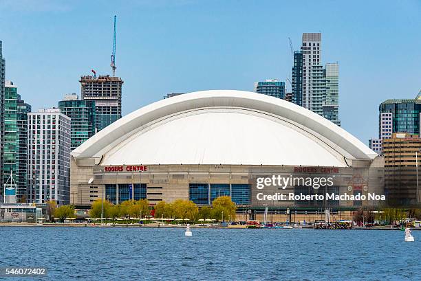 Toronto Skyline: Roger Center seen from lake Ontarion. The landmark is a multi-purpose stadium in downtown Toronto, it is home to the Toronto Blue...