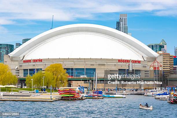 Toronto Skyline: Roger Center seen from lake Ontarion. The landmark is a multi-purpose stadium in downtown Toronto, it is home to the Toronto Blue...