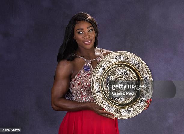 Wimbledon ladies singles Tennis Champion Serena Williams of the United States poses with the trophy at the Wimbledon Champions Dinner 2016 at the...