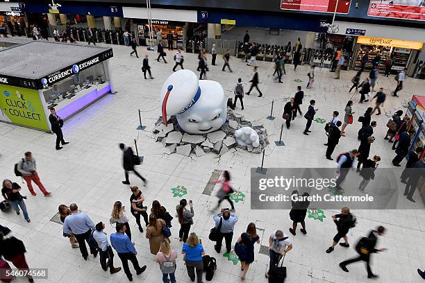 Stay Puft Marshmallow Man is seen on the concourse at Waterloo Station on July 11, 2016 in London, England. Ghostbusters take over Waterloo Station...