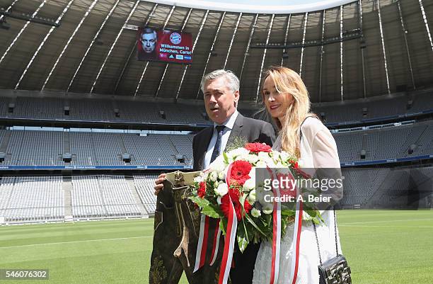 New head coach of FC Bayern Muenchen Carlo Ancelotti presents his new traditional Bavarian leather trousers he received as present together with his...