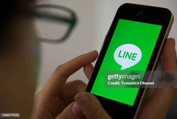 The Line Corp. Logo is displayed on a smartphone in this arranged photograph on July 11, 2016 in Tokyo, Japan. Japanese messaging app provider LINE...