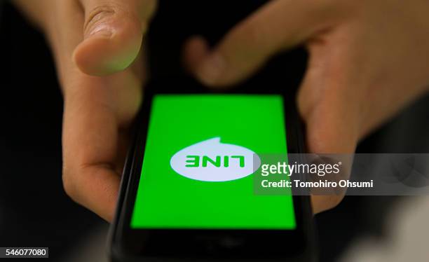 The Line Corp. Logo is displayed on a smartphone in this arranged photograph on July 11, 2016 in Tokyo, Japan. Japanese messaging app provider LINE...